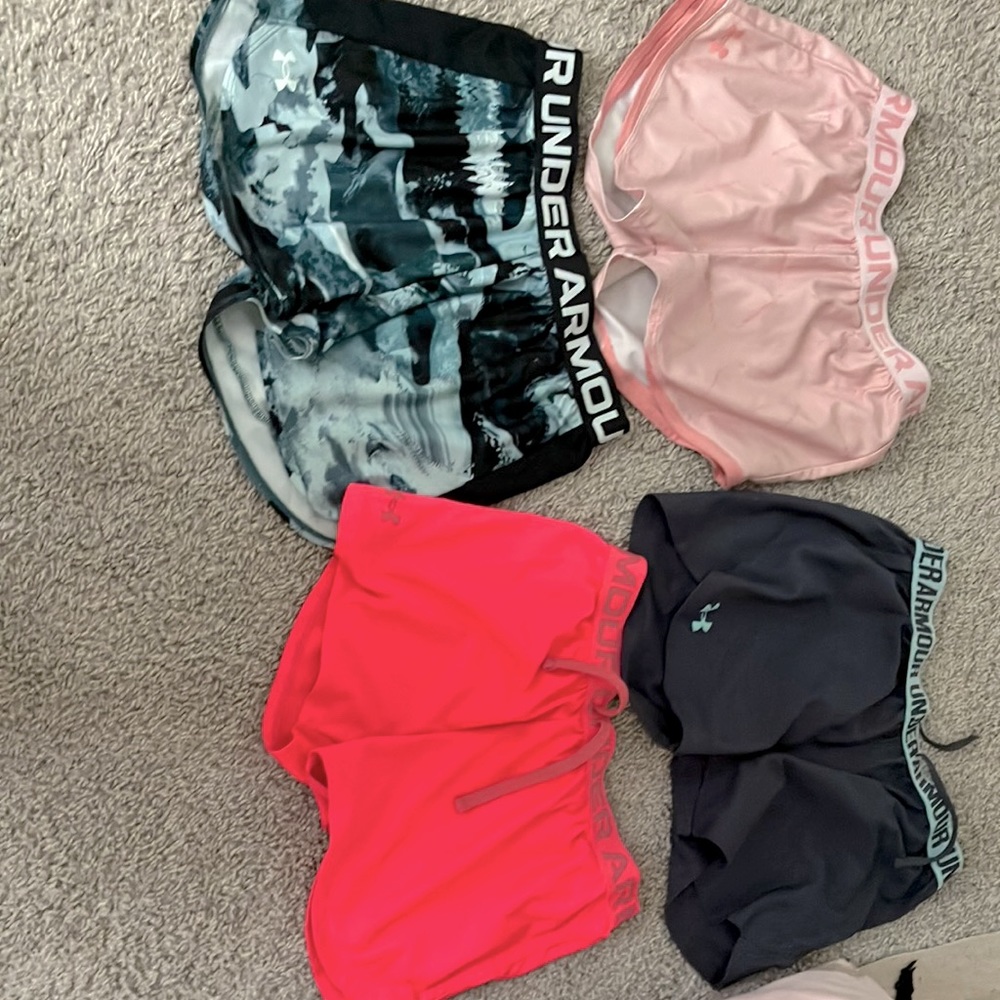 Four pack bundle of girls under armour work out shorts.
